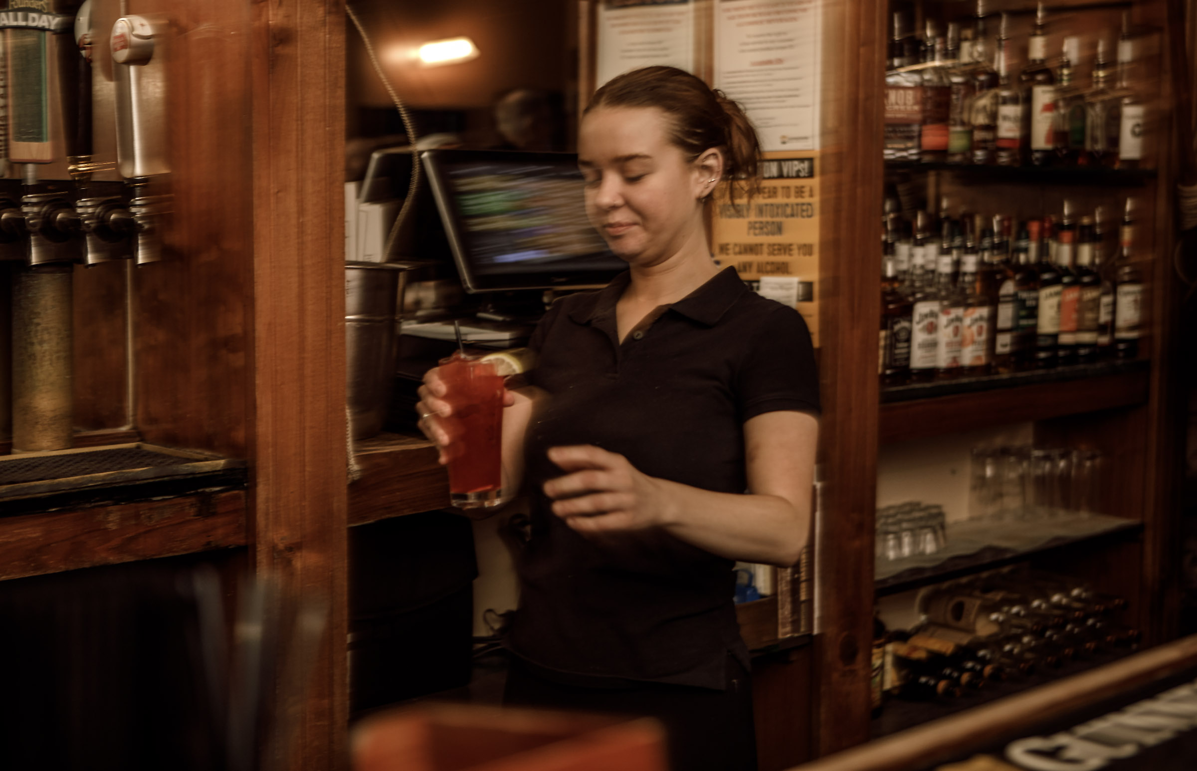Sierra Fryer of Easton serves drinks at Pearly Baker’s Alehouse,...