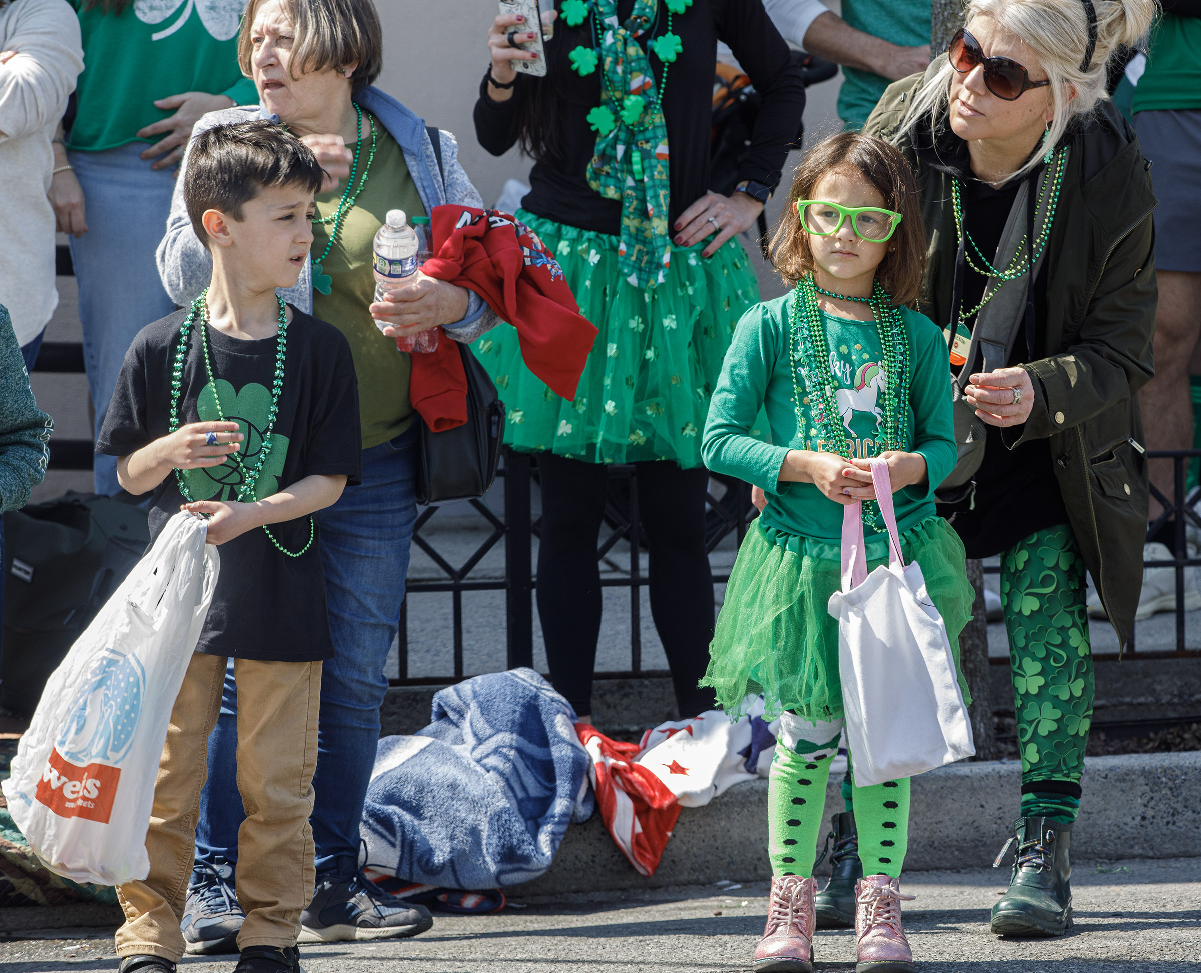 Kids wait for candy to be thrown during the St....