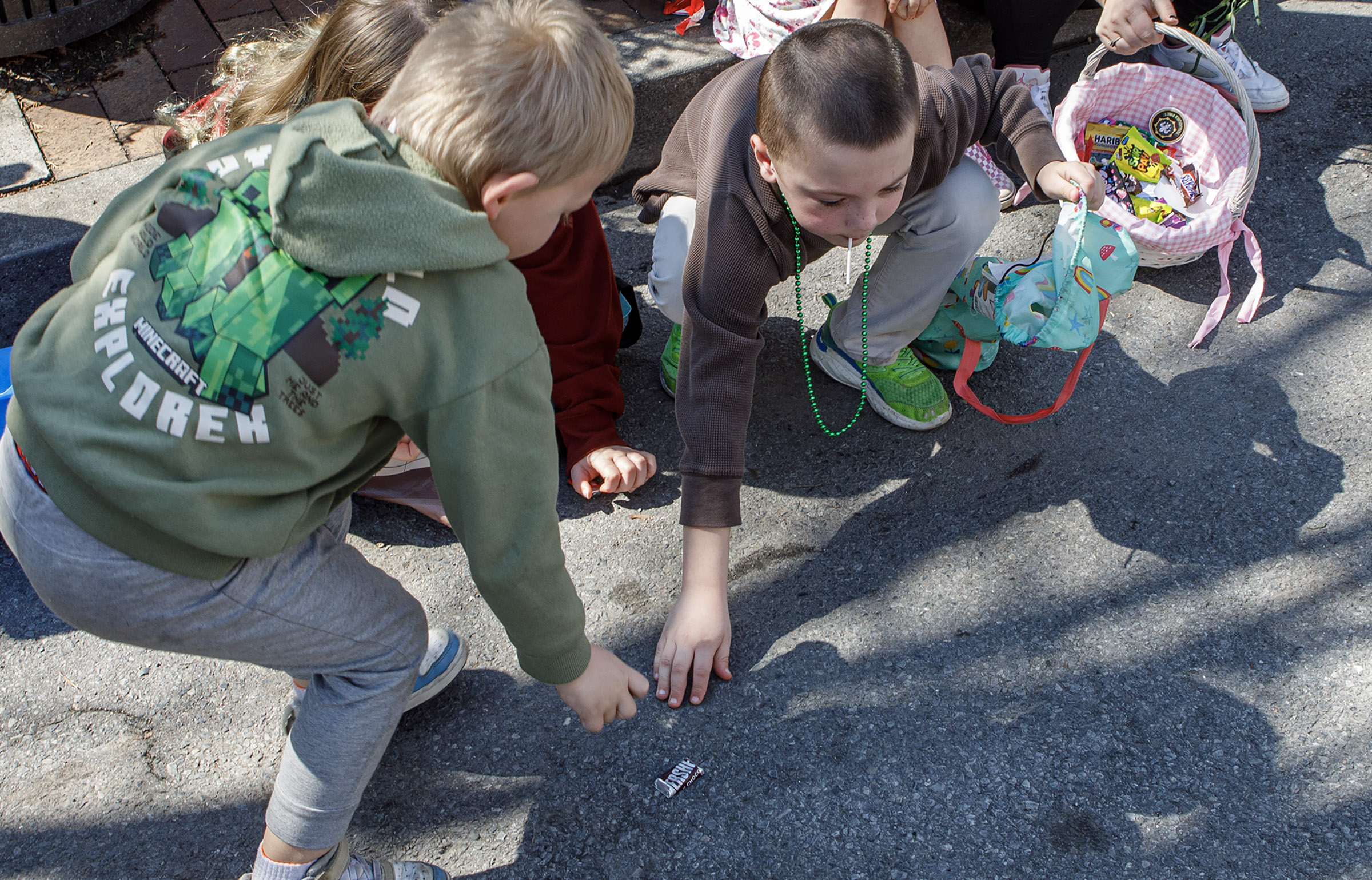 Kids grapple for candy during the St. Patrickâs Parade on...
