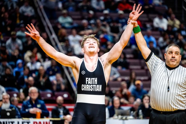 Faith Christian's Adam Waters celebrates his fourth PIAA wrestling championship after winning on Saturday in Hershey. (Nate Heckenberger photo)