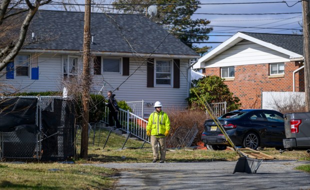 Storm damage from Monday night's strong winds is seen Tuesday, March 17, 2026, in an alleyway between Devonshire Road and South 12th Street in Allentown. Storms blew off roofs and downed trees and power lines around the Lehigh Valley, leaving thousands without electricity. (April Gamiz/The Morning Call)