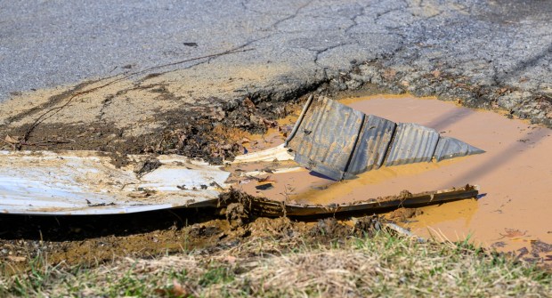 Storm damage from Monday night's strong winds is seen Tuesday, March 17, 2026, in an alleyway between Devonshire Road and South 12th Street in Allentown. Storms blew off roofs and downed trees and power lines around the Lehigh Valley, leaving thousands without electricity. (April Gamiz/The Morning Call)
