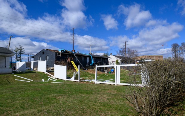 Storm damage from Monday night's strong winds is seen Tuesday, March 17, 2026, in an alleyway between Devonshire Road and South 12th Street in Allentown. Storms blew off roofs and downed trees and power lines around the Lehigh Valley, leaving thousands without electricity. (April Gamiz/The Morning Call)
