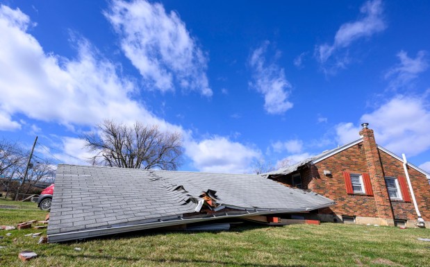Storm damage from Monday night's strong winds is seen Tuesday, March 17, 2026, at a house on Devonshire Road in Allentown. Storms blew off roofs and downed trees and power lines around the Lehigh Valley, leaving thousands without electricity. (April Gamiz/The Morning Call)