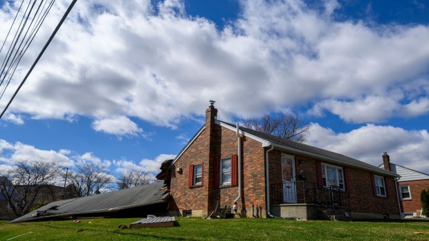 Storm damage from Monday night's strong winds is seen Tuesday, March 17, 2026, at a house on Devonshire Road in Allentown. Storms blew off roofs and downed trees and power lines around the Lehigh Valley, leaving thousands without electricity. (April Gamiz/The Morning Call)
