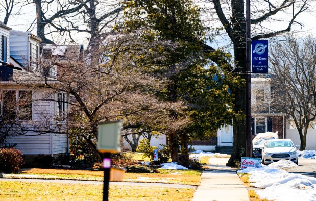 A banner reading "60 Years of Community Pride" Community Midway Manor Association greets visitors in the neighborhood Friday, Feb. 27, 2026, in Allentown. Neighbors were worried that plans to expand the Sonia Sotomayor Dual Language Immersion Academy would lead to the demolition of the buildings. However, Allentown School Board members approved a plan that would leave them intact. (April Gamiz/The Morning Call)