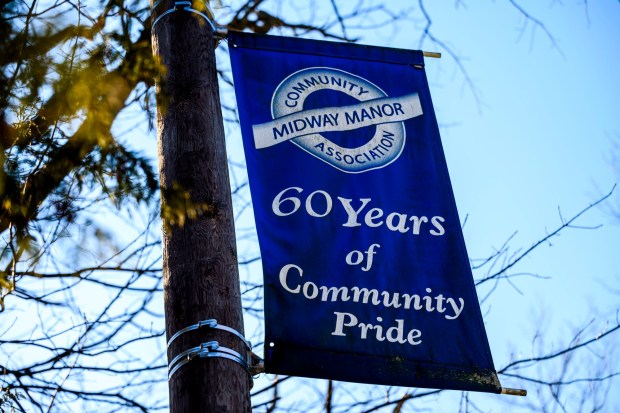 A banner reading "60 Years of Community Pride" Community Midway Manor Association greets visitors in the neighborhood Friday, Feb. 27, 2026, in Allentown. Neighbors were worried that plans to expand the Sonia Sotomayor Dual Language Immersion Academy would lead to the demolition of the buildings. However, Allentown School Board members approved a plan that would leave them intact. (April Gamiz/The Morning Call)