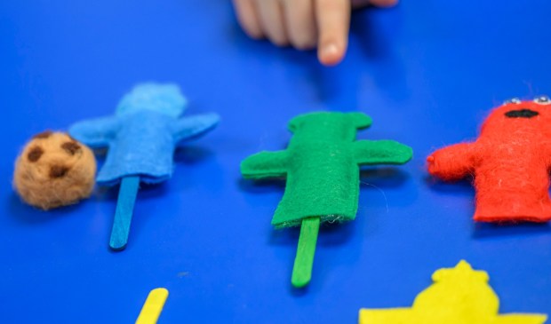 Third graders create a story and puppets with the help of Moravian University students Monday, March 2, 2026, at William Penn Elementary School in Bethlehem, where Moravian University students are running a story workshop for third graders. The university students, part of Moravian's art and child development education course, are using puppets to engage the third graders in shaping characters and themes for original children's books. (April Gamiz/The Morning Call)