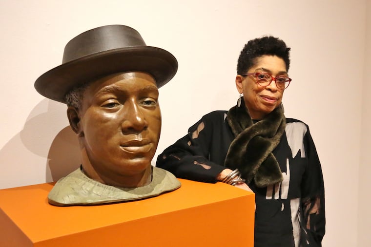 Syd Carpenter with a bust of her brother Frank, one of the sculptures in the Woodmere Museum's show â€œSyd Carpenter: Planting in Place, Time, and Memory"