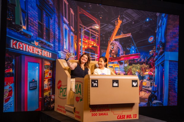 Get into a roller coaster seat at "Universal Theme Parks: The Exhibition" at the Franklin Institute. (Photo by The Franklin Institute)