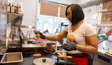 Mia Robertson, owner of Bikini Burger, makes a cheeseburger at Bikini Burger in Ardmore, Pa.