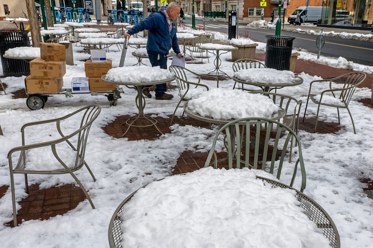 Snow remains in a cafe’s outdoor seating on the University of Pennsylvania late last month. Temperature changes in March have been dramatic.