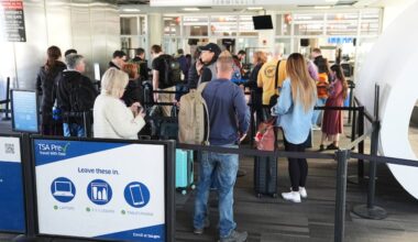 Travelers stand in line at a TSA screening area at Philadelphia International Airport in November.