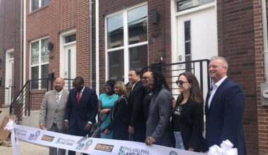 City Council President Kenyatta Johnson and Mayor Cherelle L. Parker (second and third from left) join other officials in marking the 100th sale through the city's Turn the Key affordable housing program in September 2024.