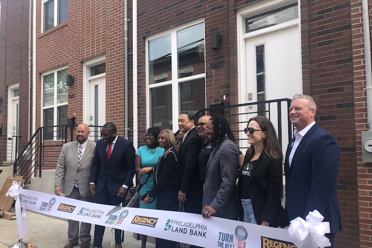 City Council President Kenyatta Johnson and Mayor Cherelle L. Parker (second and third from left) join other officials in marking the 100th sale through the city's Turn the Key affordable housing program in September 2024.