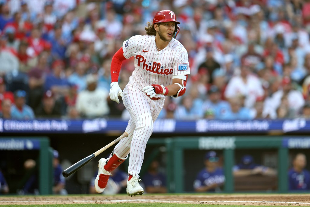 Alec Bohm of the Philadelphia Phillies running after hitting a three-run home run.