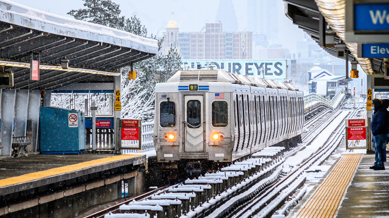 SEPTA train approaching the station on a snowy day, Philadelphia