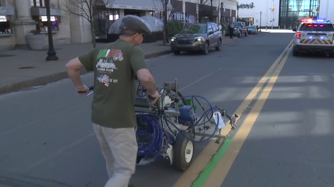 A sure sign of Parade Day in Scranton: 'Irish' Gene Reed paints the parade route