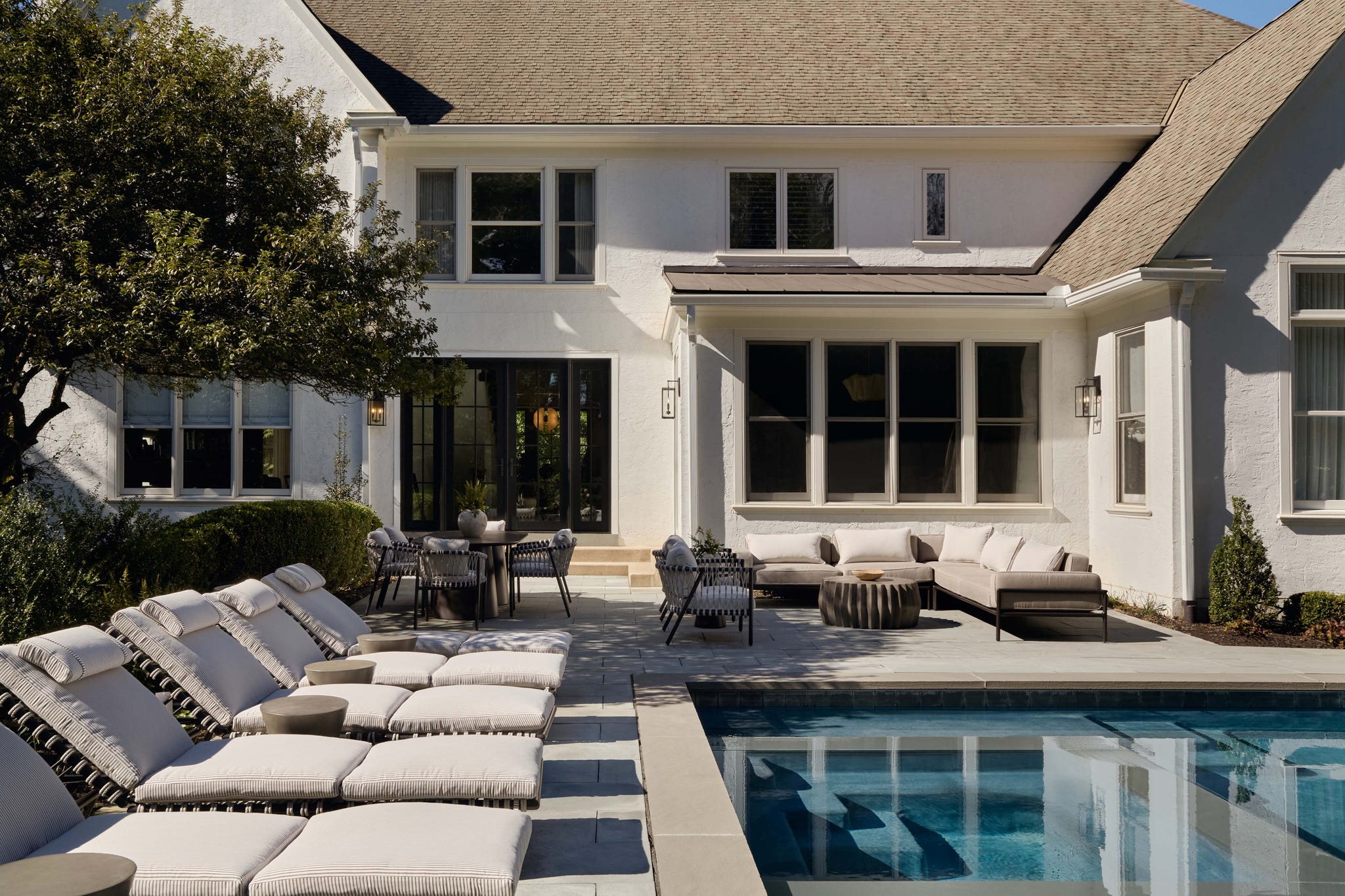 Backyard with pool and outdoor seating area.