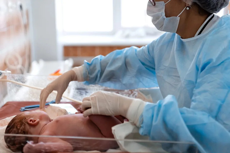 Stock photo of a nurse and baby.Credit: Getty