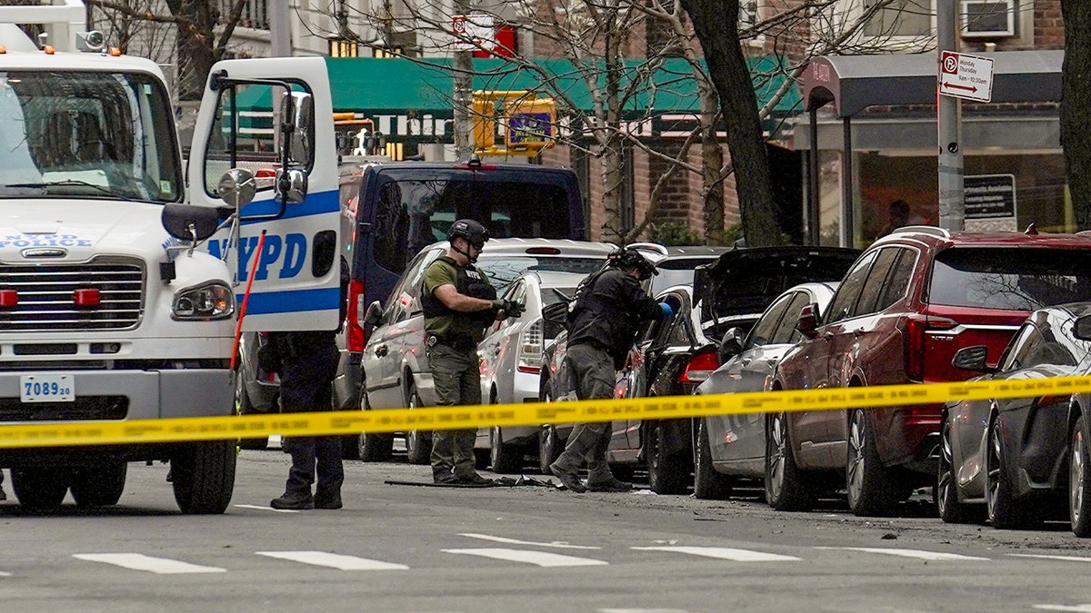 NYPD Bomb Squad officers examine a vehicle in New York City during an investigation linked to an attempted explosive attack.