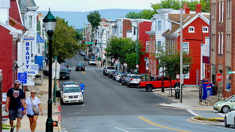 A couple walks down a colorful street in Hagerstown, Maryland