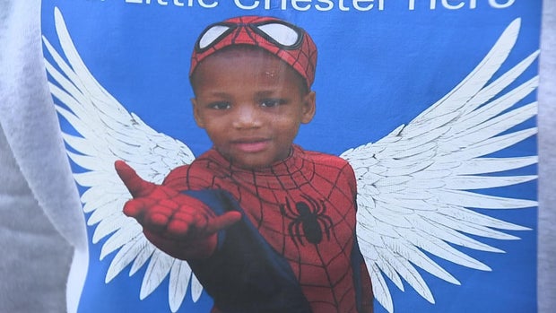 A photo of Ny'Leek dressed as Spiderman, he has angel wings added in the picture 