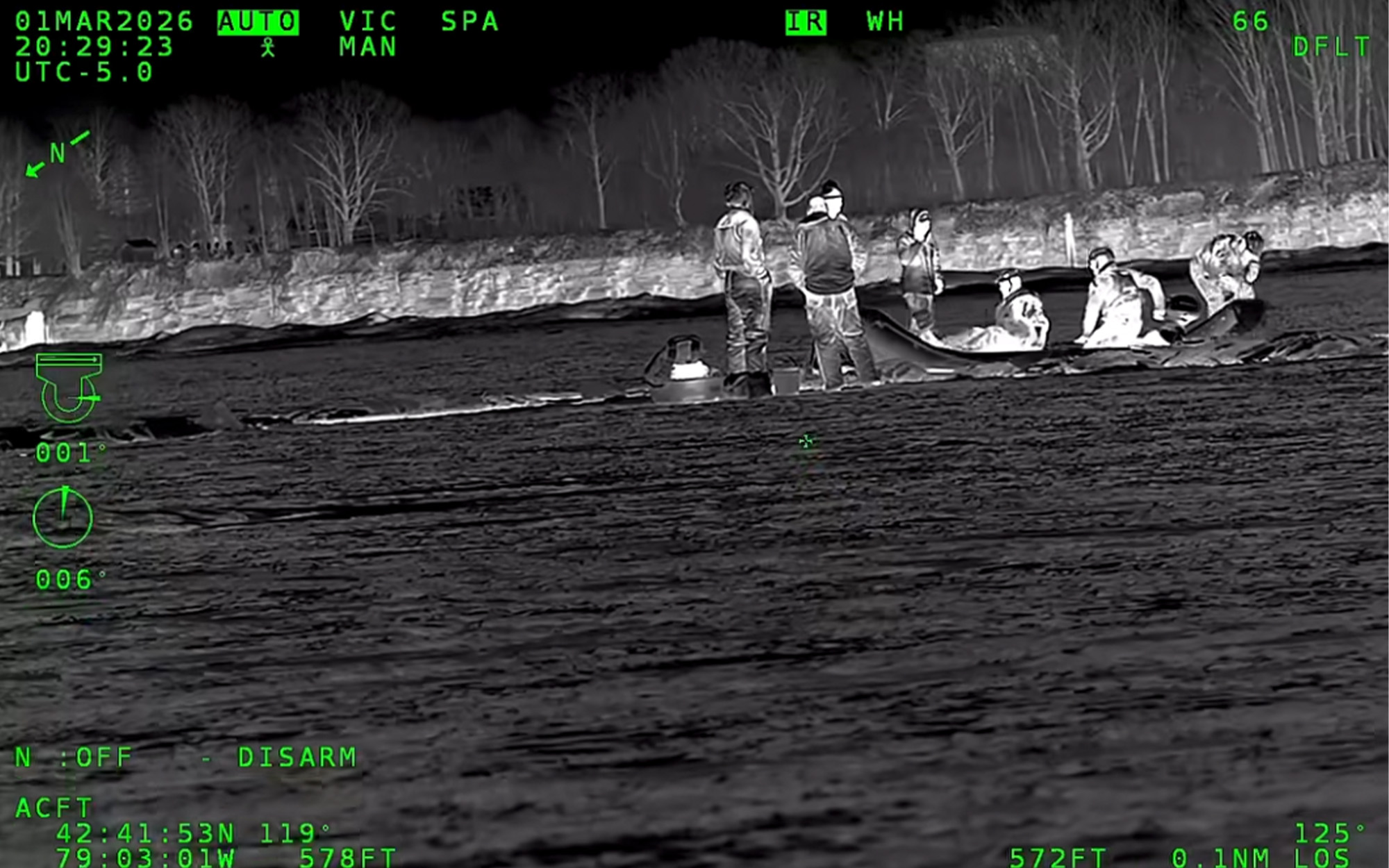 Ice fishermen being rescued by the USCG.