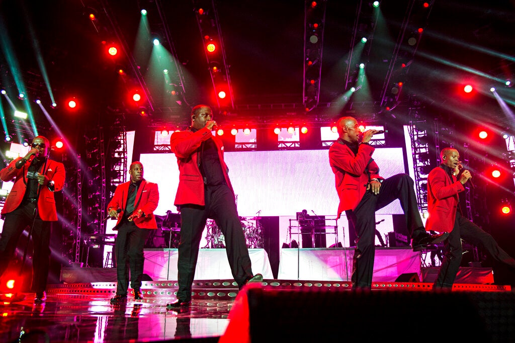 The band New Edition performs on stage