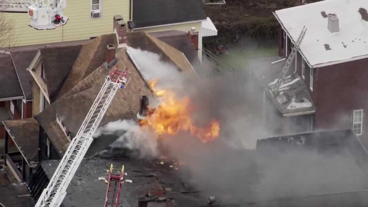 Crews battle flames in Glassport as smoke pours from home