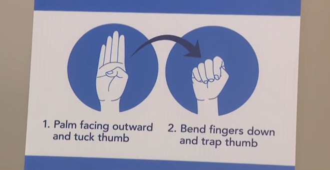universal human trafficking hand signal
