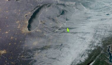Satellite map of Great Lakes region with yellow anomaly over Ohio.