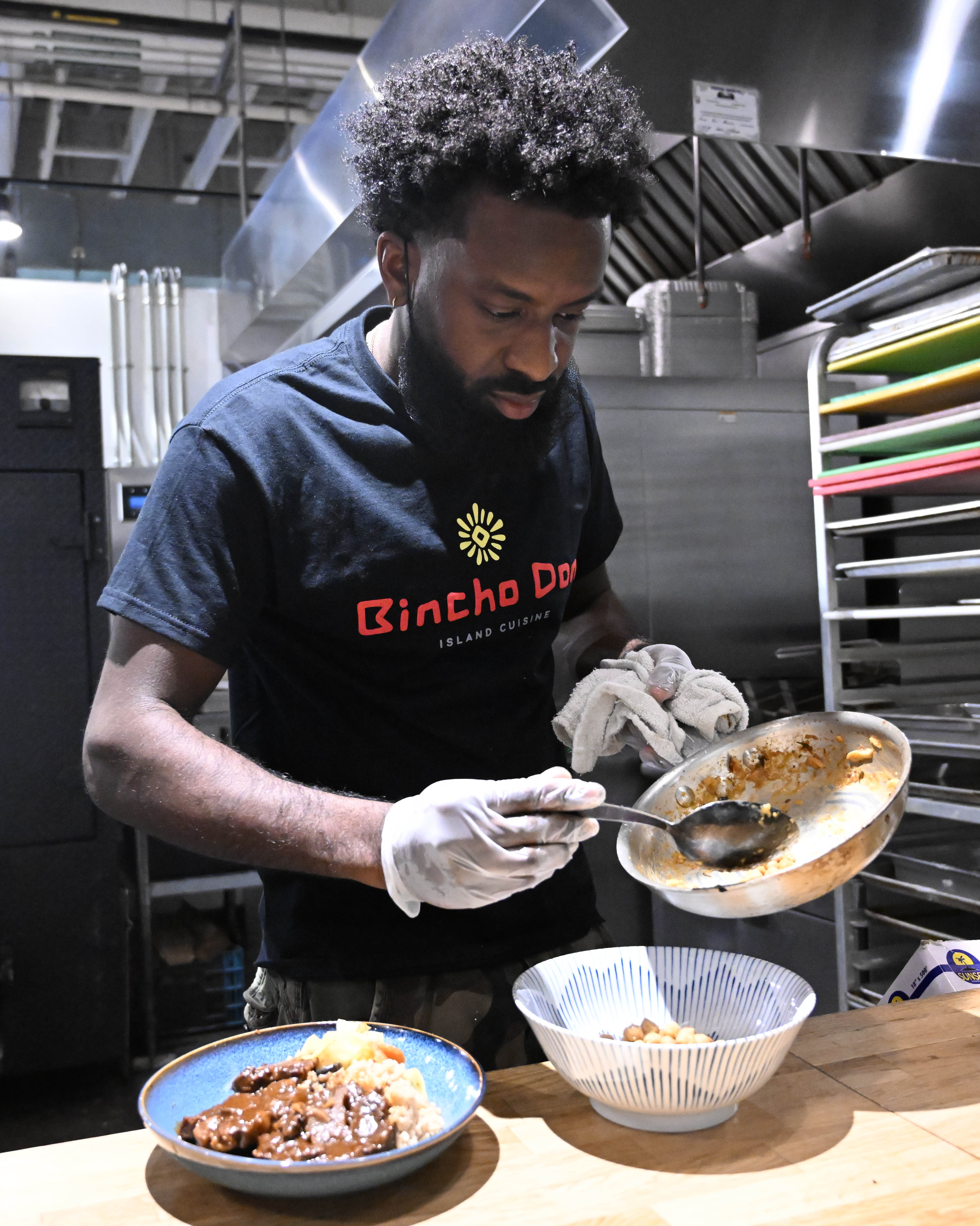Kadon Barnwell plates samples of dishes on the menu sit...
