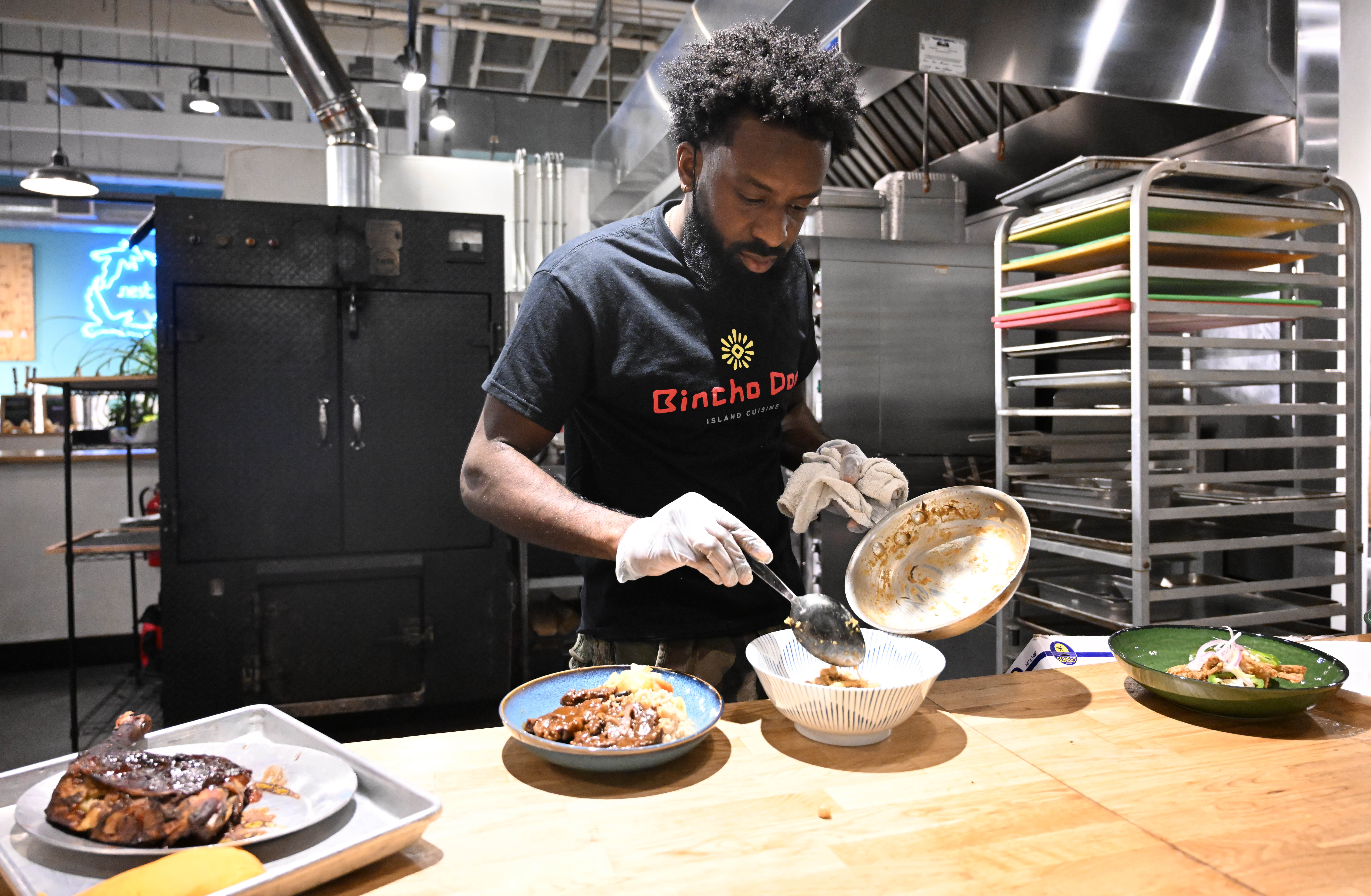Kadon Barnwell plates samples of dishes on the menu sit...