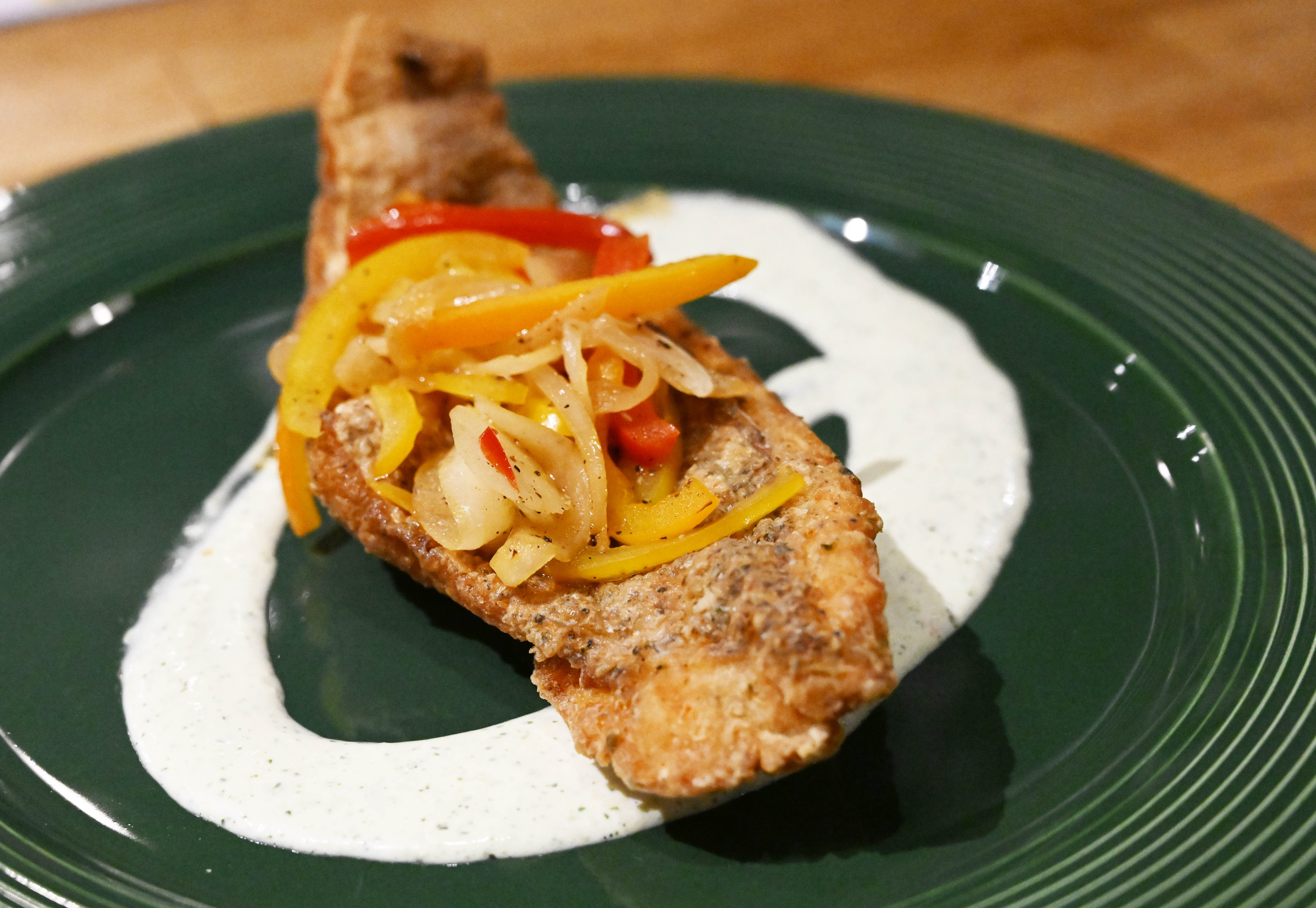 Dish snapper escovitch is seen Wednesday, March 18, 2026, at...