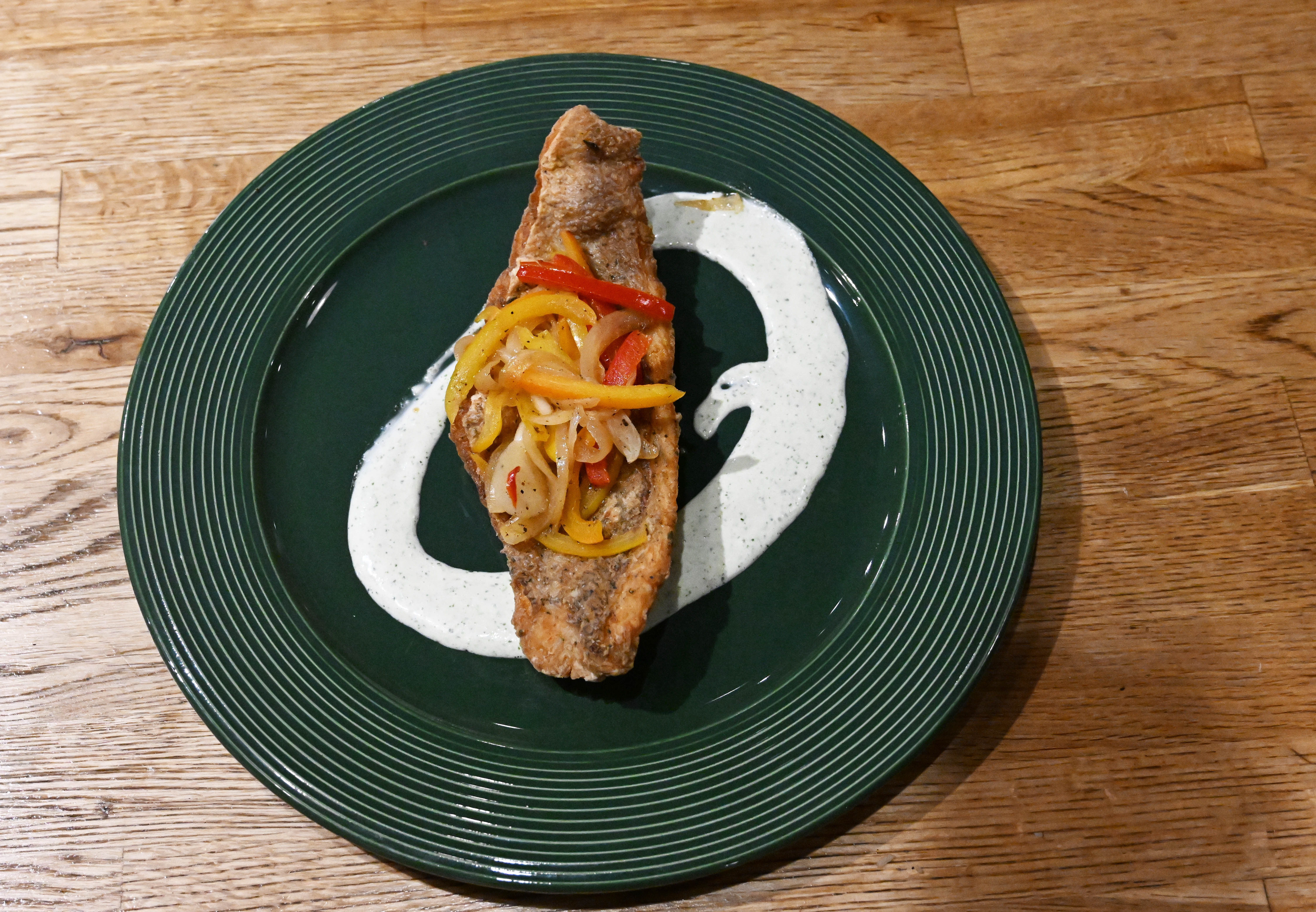 Dish snapper escovitch is seen Wednesday, March 18, 2026, at...