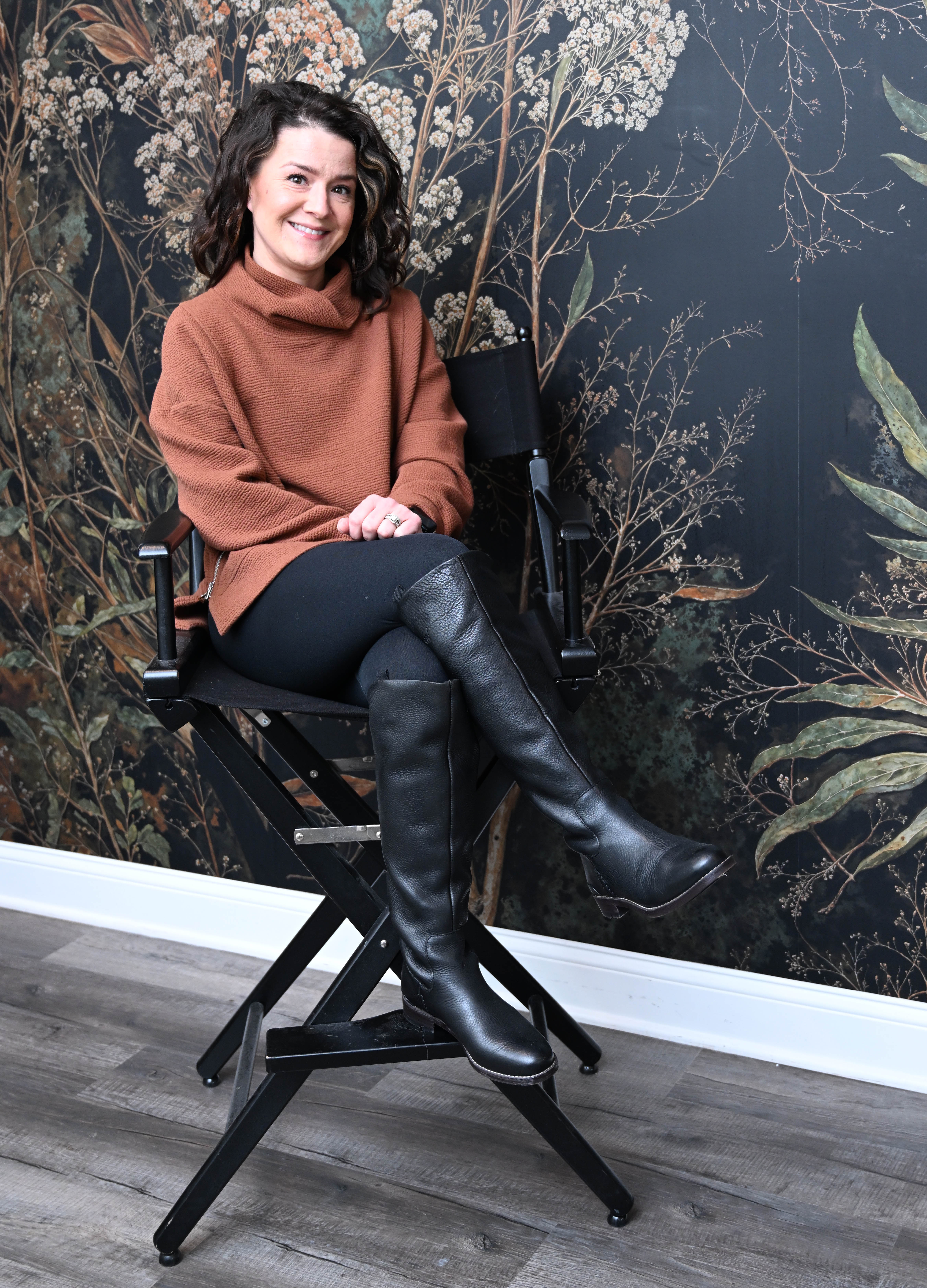 Brit Stoneback sits Wednesday, Feb. 25, 2026, in her business,...