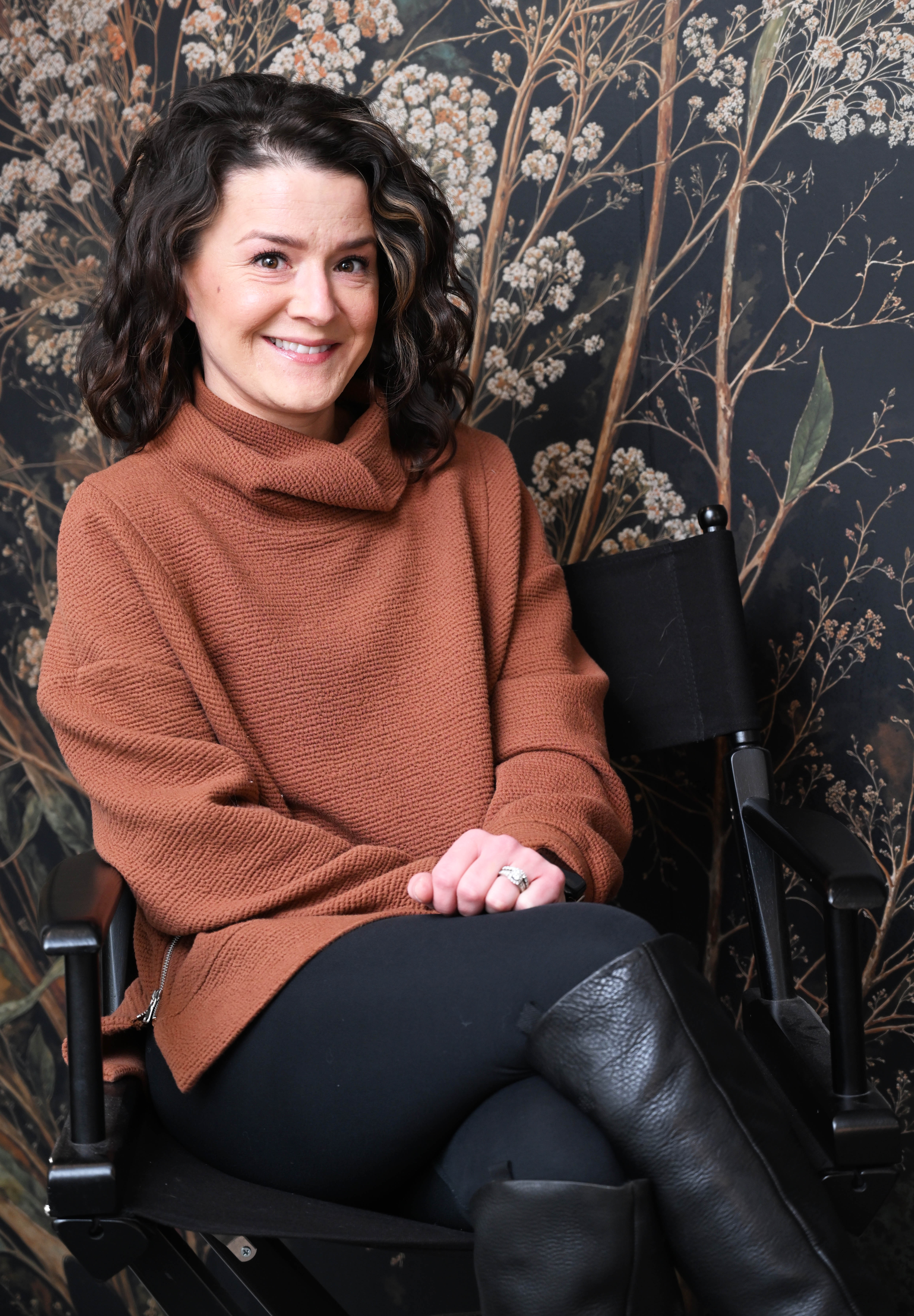 Brit Stoneback sits Wednesday, Feb. 25, 2026, in her business,...