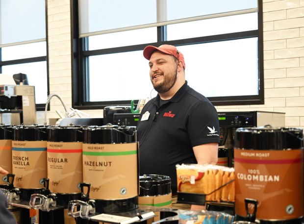 Mike Chisholm, the general manager of the new Wawa, greets customers Thursday, March 12, 2026, during the store's grand opening in Whitehall Township. (Amy Shortell/The Morning Call)