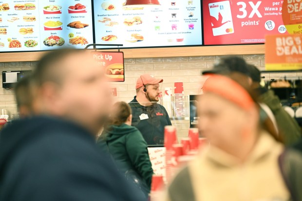 Mike Chisholm, the general manager of the new Wawa, makes food orders Thursday, March 12, 2026, during the store's grand opening in Whitehall Township. (Amy Shortell/The Morning Call)