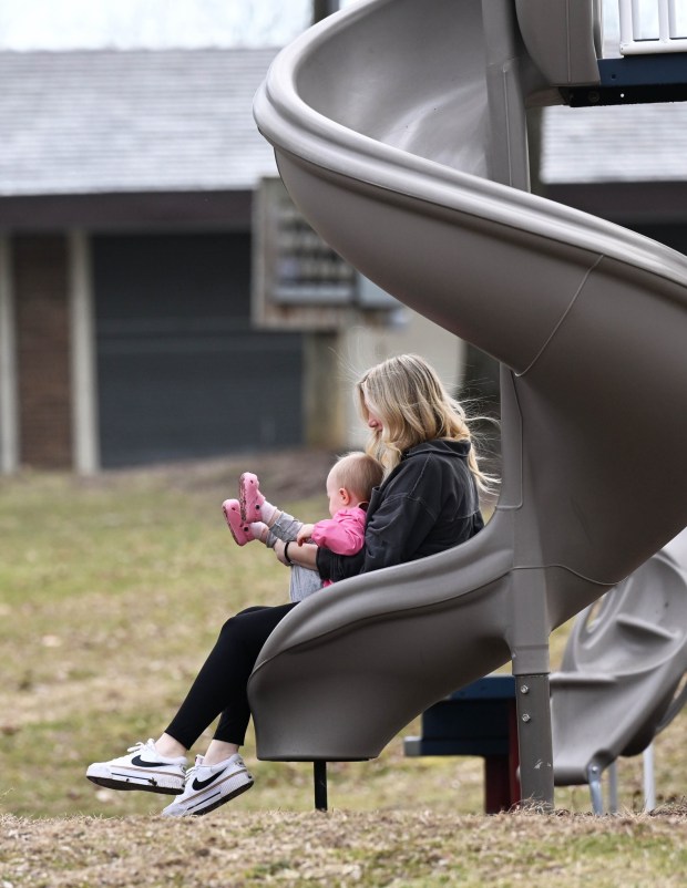 Alivea Foloweiler and her daughter, Ellie DeRosa, enjoy a slide Wednesday, March 11, 2026, at Saylor Park in Coplay. (Amy Shortell/The Morning Call)