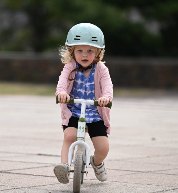 Robin White, 2, rides her balance bike Wednesday, March 11, 2026, at Payrow Plaza in Bethlehem. (Amy Shortell/The Morning Call)