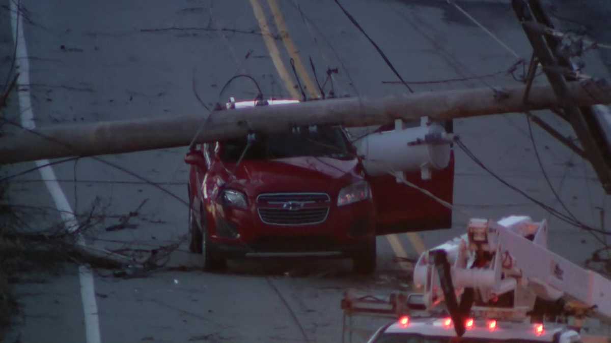 Utility pole falls on car in North Versailles, Allegheny County