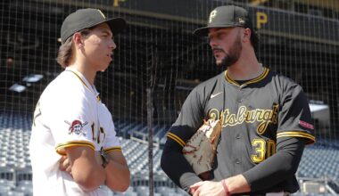 Jul 22, 2025; Pittsburgh, Pennsylvania, USA;  Seth Hernandez (left) the Pittsburgh Pirates first round and number six overall pick in the 2025 first year player draft talks with Pirates pitcher Paul Skenes (30) before the game against the Detroit Tigers at PNC Park. Mandatory Credit: Charles LeClaire-Imagn Images