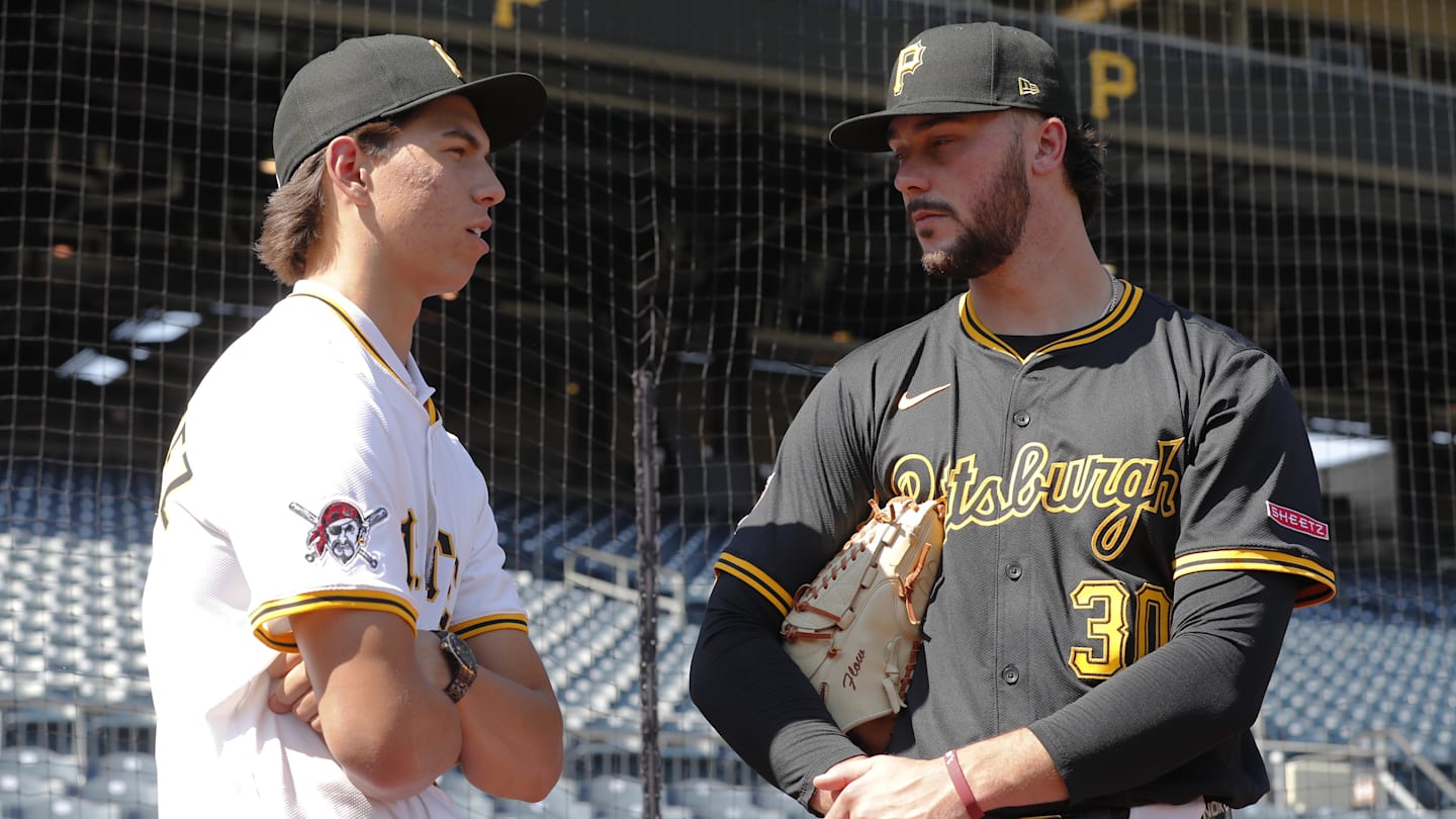 Jul 22, 2025; Pittsburgh, Pennsylvania, USA;  Seth Hernandez (left) the Pittsburgh Pirates first round and number six overall pick in the 2025 first year player draft talks with Pirates pitcher Paul Skenes (30) before the game against the Detroit Tigers at PNC Park. Mandatory Credit: Charles LeClaire-Imagn Images