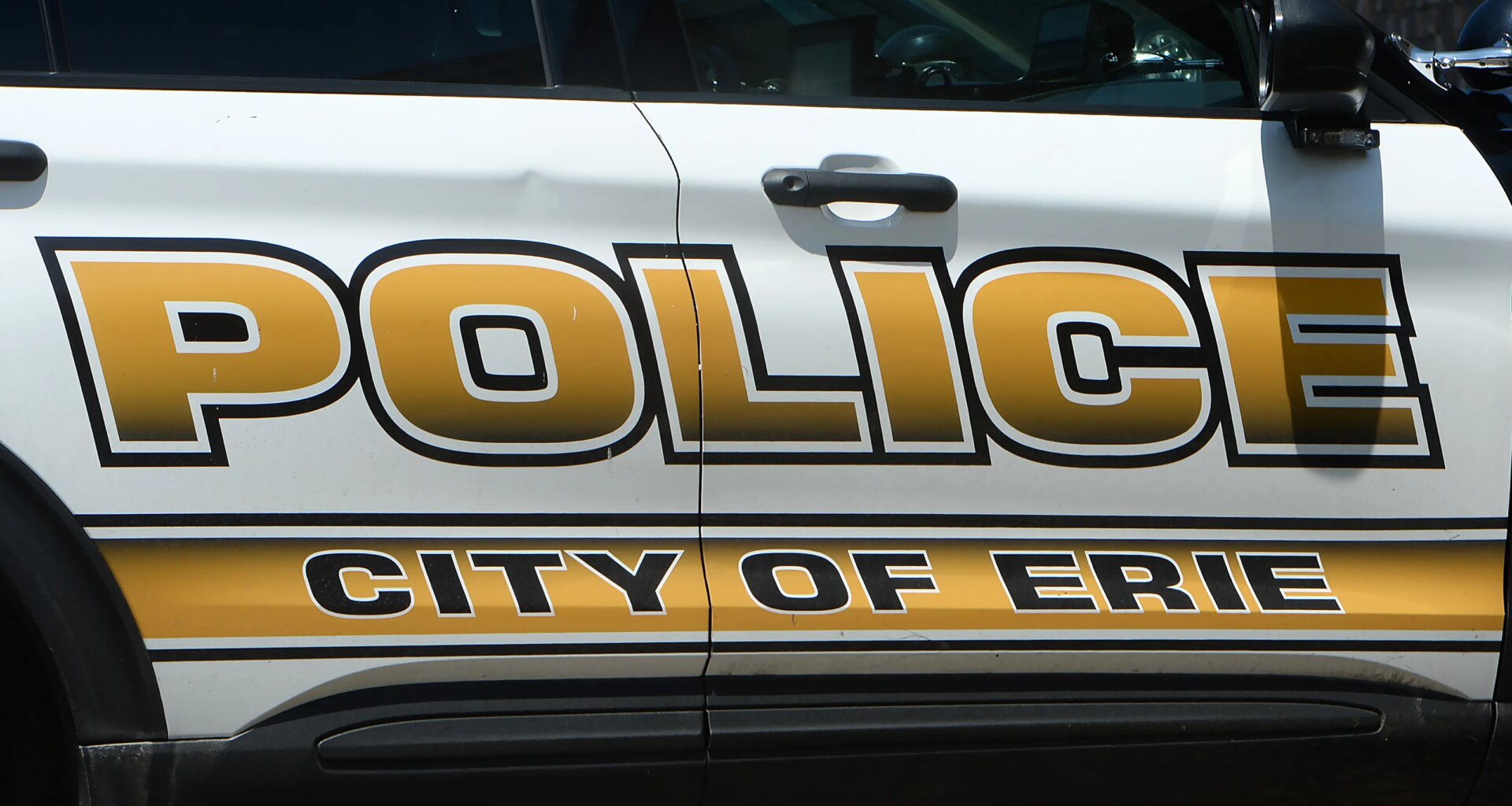 Crash into back of police car has Erie man facing criminal charges