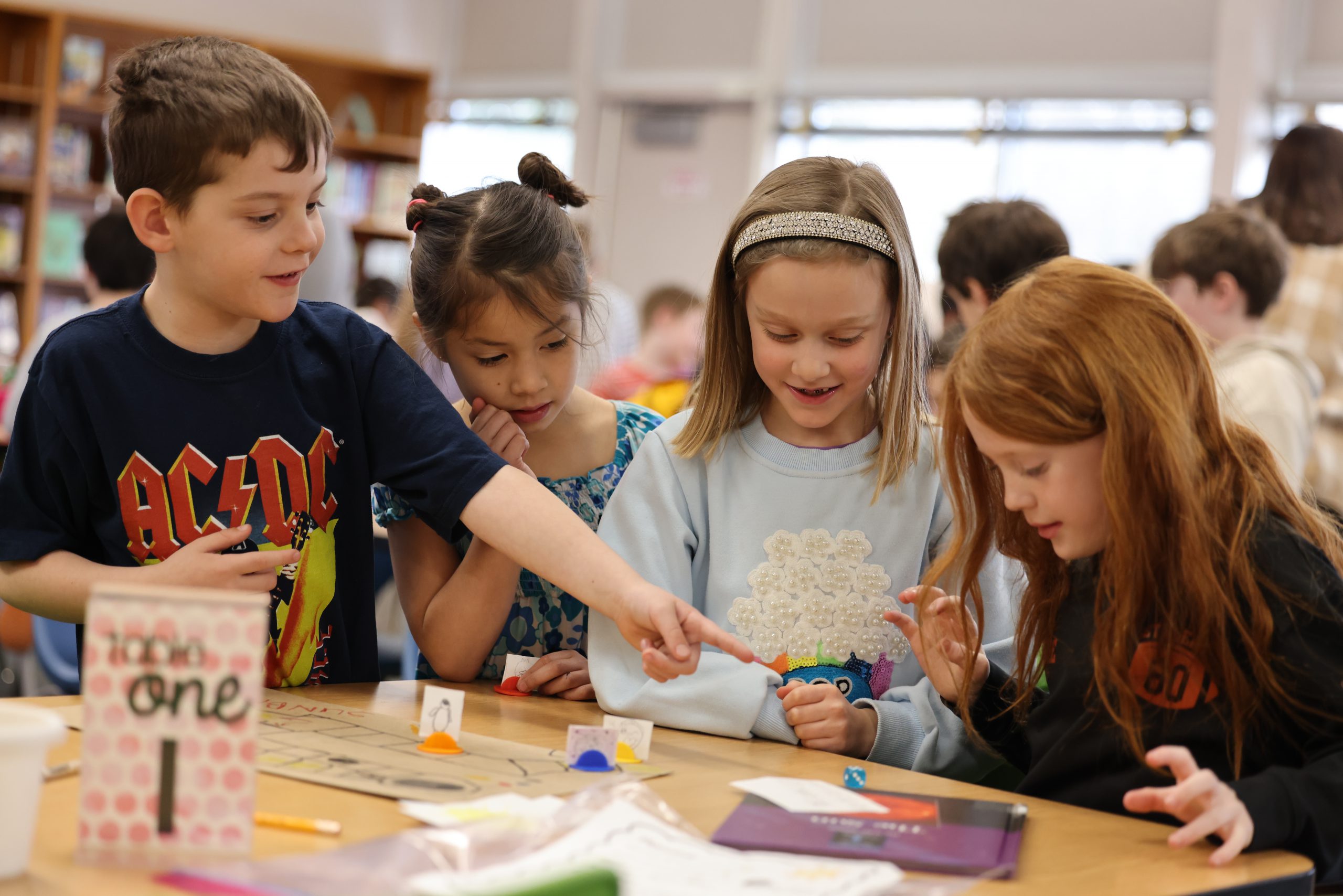 students playing board game
