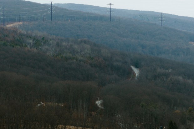 Wildcat Road winds up the mountain looking north towards a section of power lines in the Eynon section of Archbald Friday, January 9, 2026. (SEAN MCKEAG / STAFF PHOTOGRAPHER)