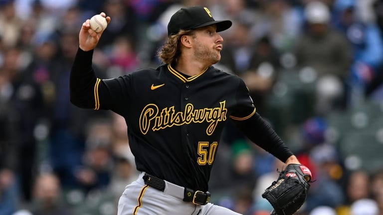 Pittsburgh Pirates starter Carmen Mlodzinski delivers a pitch during the...