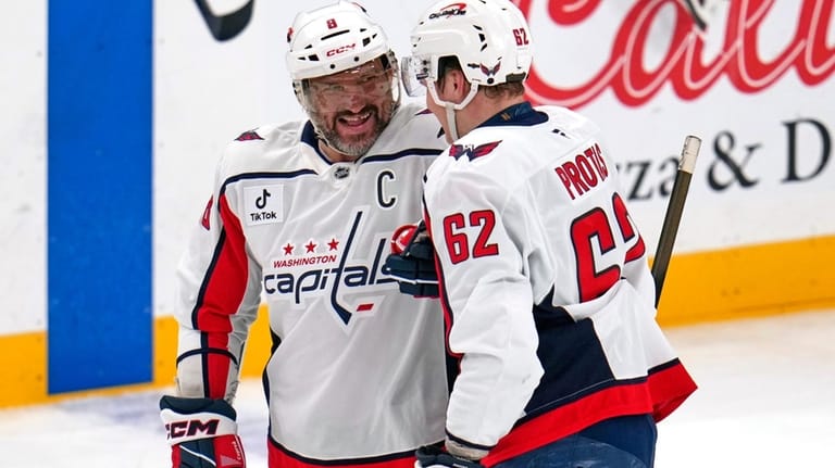 Washington Capitals' Ilya Protas (62) celebrates with Alex Ovechkin (8)...